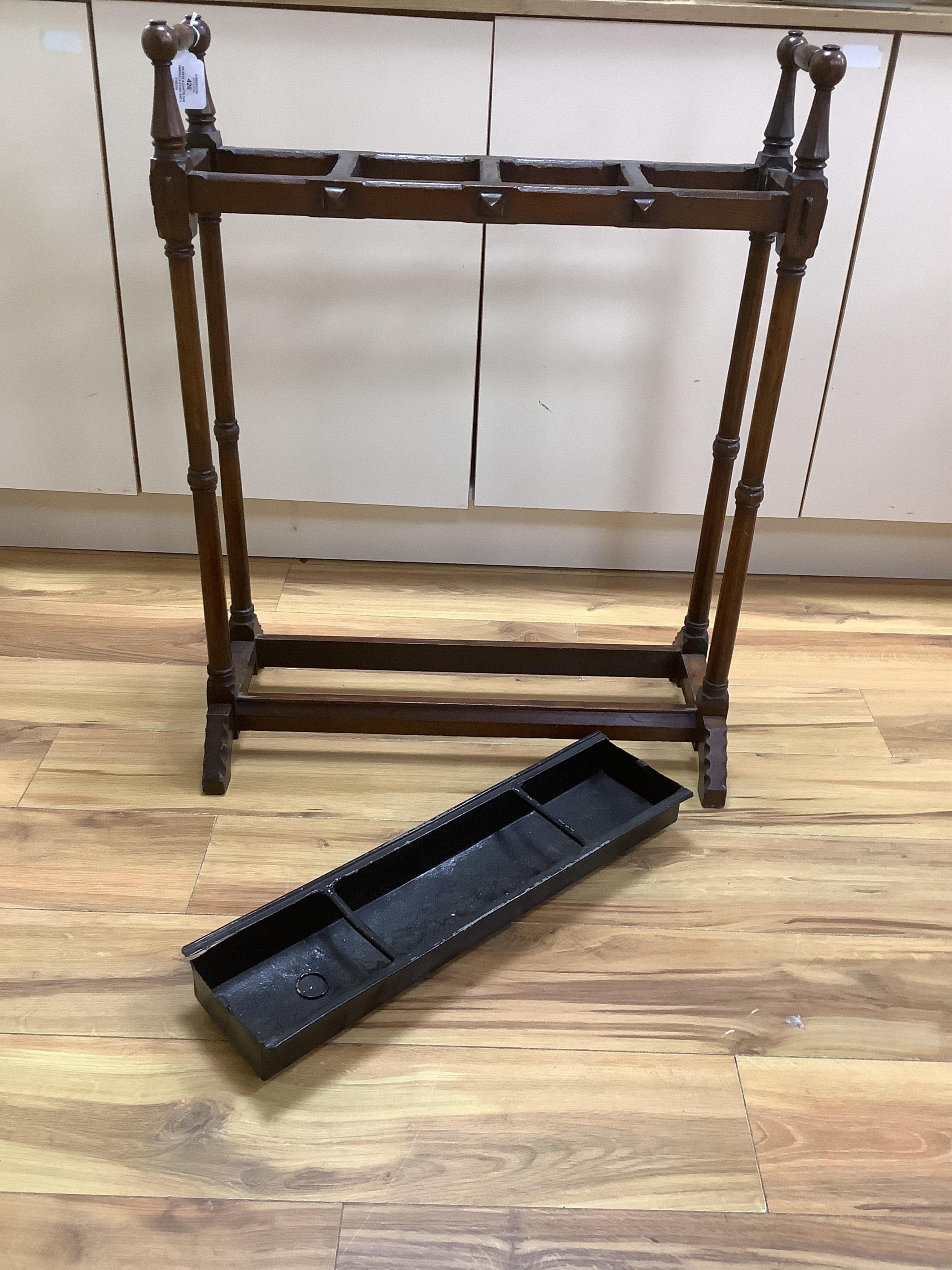 An Arts & Crafts oak umbrella stand and various walking sticks including two silver mounted. Condition - varies